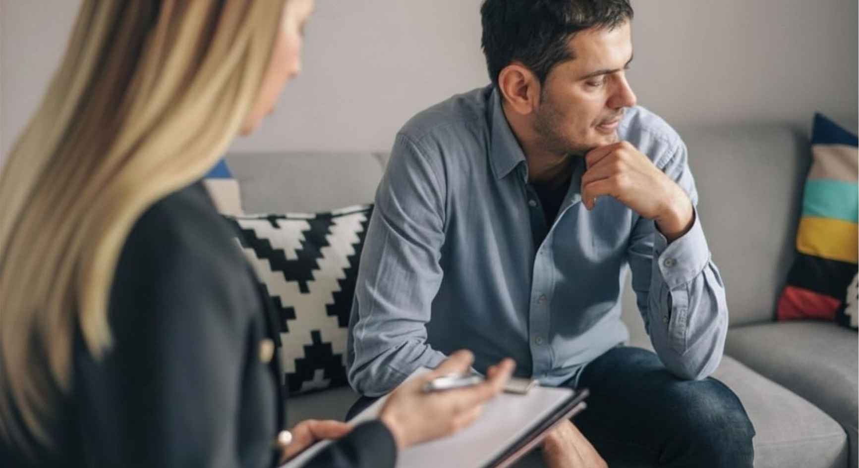 Man reflecting during a private counseling session with a professional