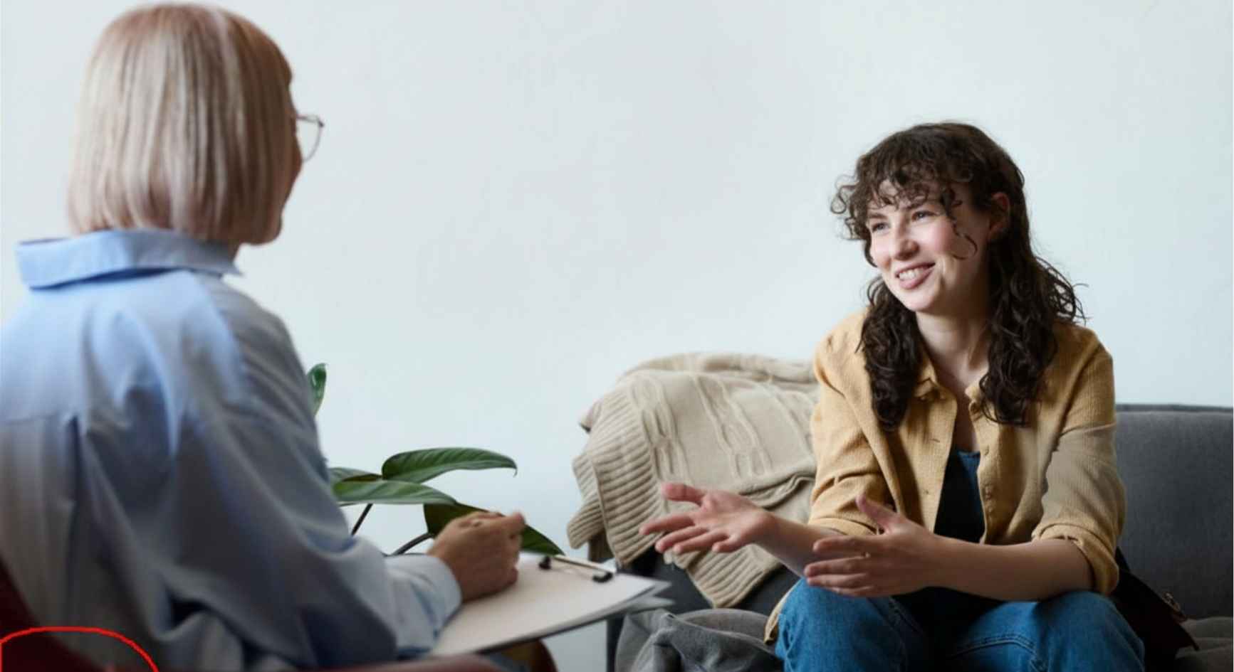 Woman smiling during a counseling session as part of a 90 day recovery program.
