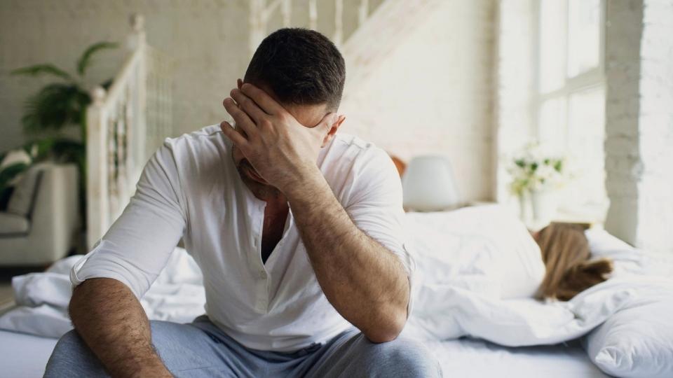 How Long Do I Need a Recovery Coach a man thinks about the answer while dealing with withdrawal and cravings.