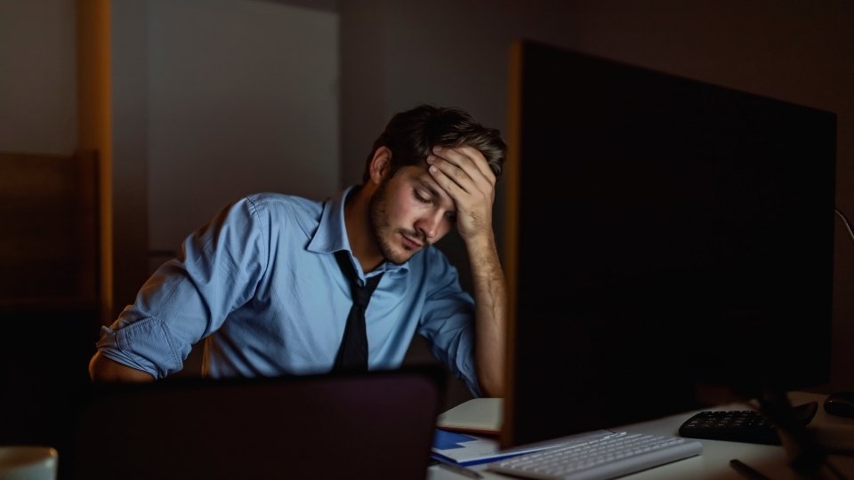 What Does a Mental Health Coach Do they can help you deal with stress, like the man in the photo is experiencing.